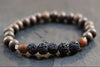 braunes Holz Perlen Armband Herren mit schwarzen Lavaperlen und edlen Details in silberfarben