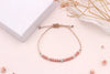 Blumenkind Armband mit Rose und silberfarbenen Perlen und einfach verstellbarem Makramee Verschluss