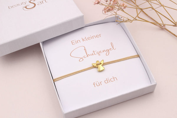 Goldfarbenes Schutzengel Armband mit Karte in einer edlen Schmuckschachtel verpackt