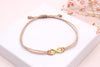Infinity Armband Damen aus Makramee mit goldfarbenem Infinity Symbol