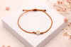 oranges Makramee Armband mit Herzperle als Einschulungsgeschenk für Kinder