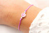 Rosa Schulkind Armband mit Herzperle uns silberfarbenen kleinen Perlen
