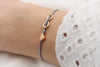 graues Armband Infinity Herz Farbe rosegold, Unendliche Liebe am Handgelenk getragen